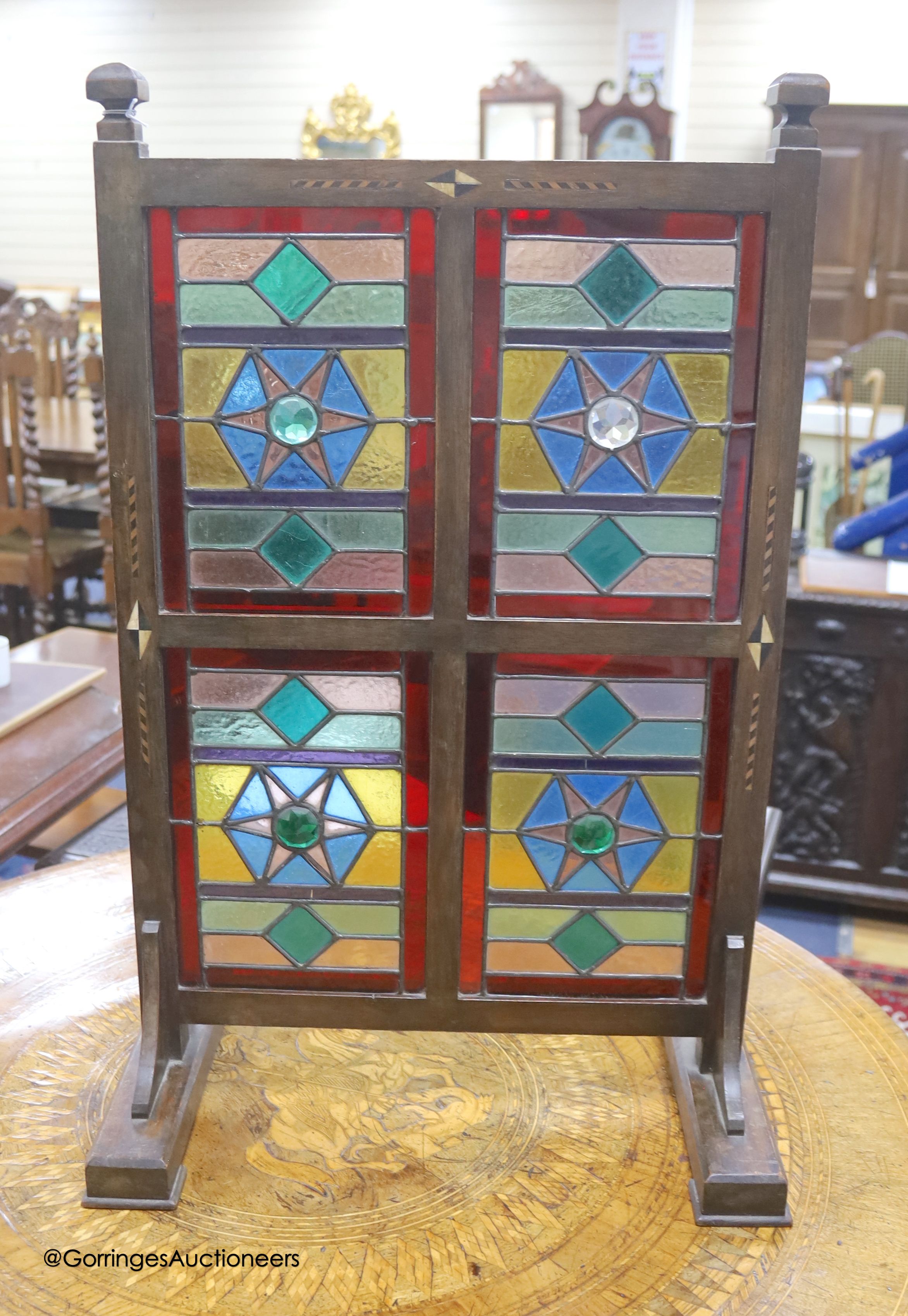 An Edwardian Liberty & Co. stained glass and beech leaded glass room screen, width 43cm, height 67cm